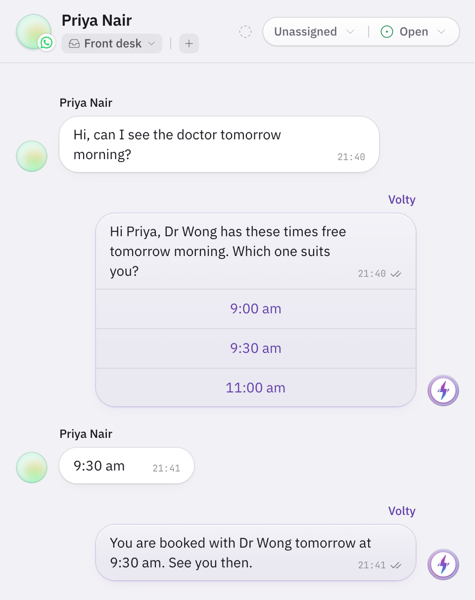 A WhatsApp conversation in Volty at 9.40pm. The patient asks to see the doctor tomorrow morning, Volty offers three free times as buttons, the patient taps 9:30 am and Volty confirms the booking.
